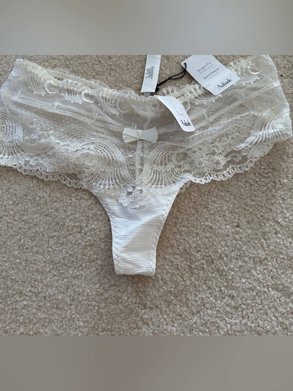 Aubade Ivory Lace Thong with Bow Accent